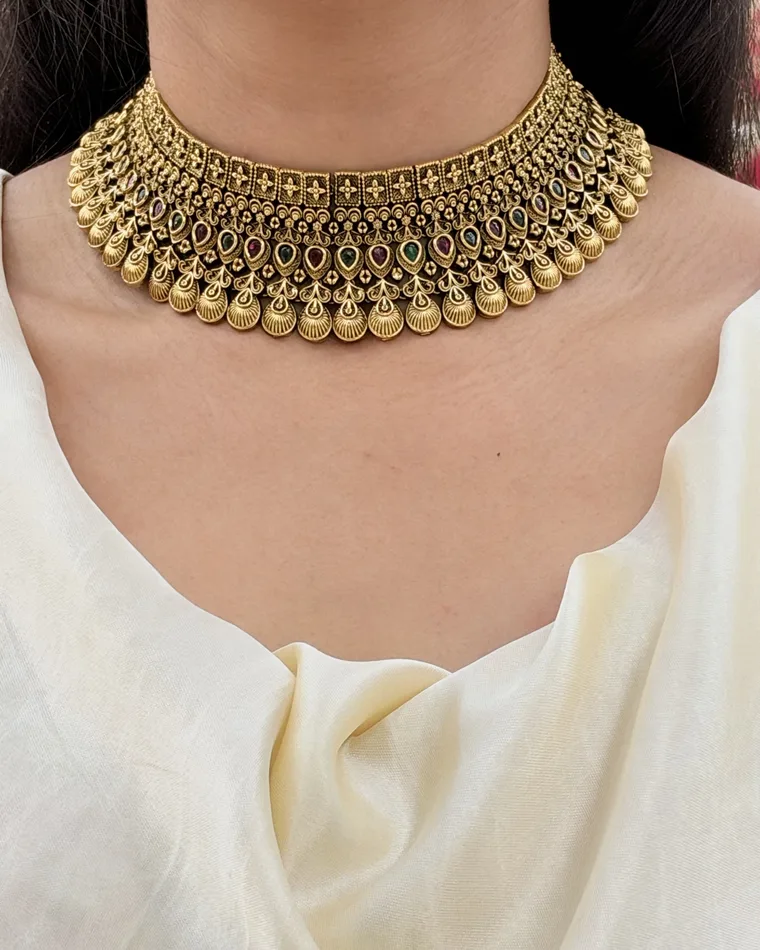 Luxurious gold-plated antique finish choker necklace and statement dangle earrings set with ruby and emerald stones — antique choker set Calgary