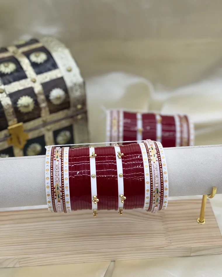 Heritage deep maroon Punjabi bridal chura set with painted flower motifs and gold bead charms, sizes 2.4 to 2.8 — bridal chooda Calgary