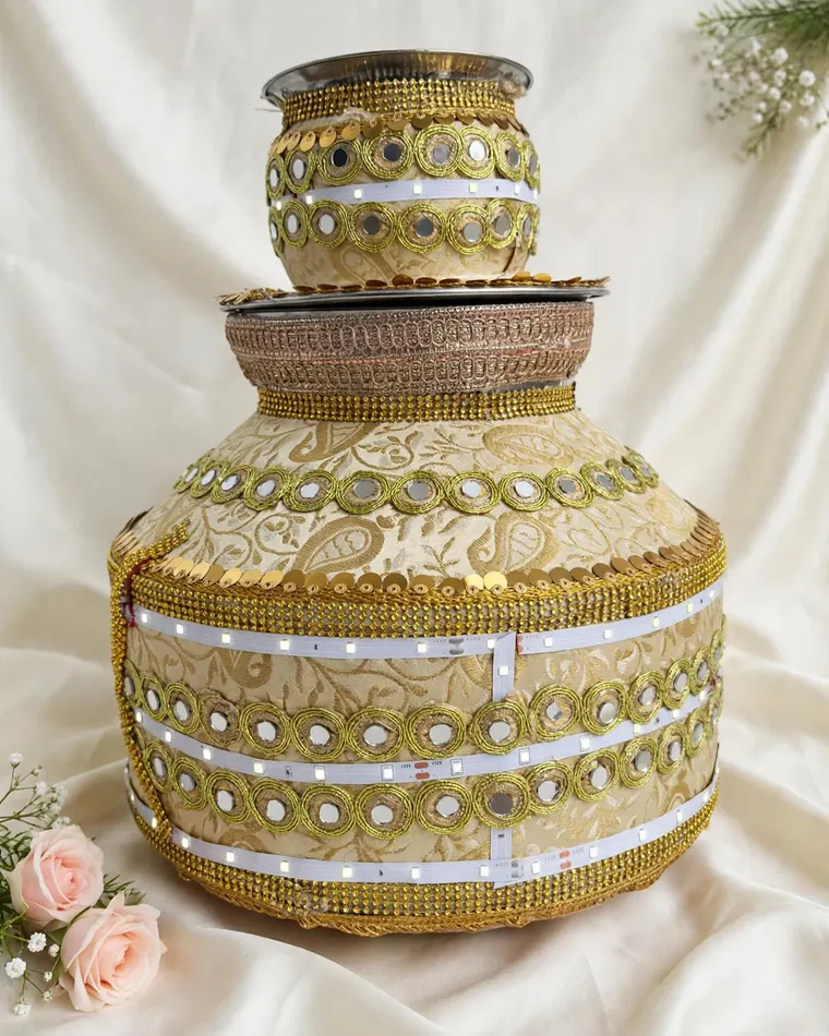Elegant beige and gold paisley jaggo with mirror work and LED lights for rent in Calgary