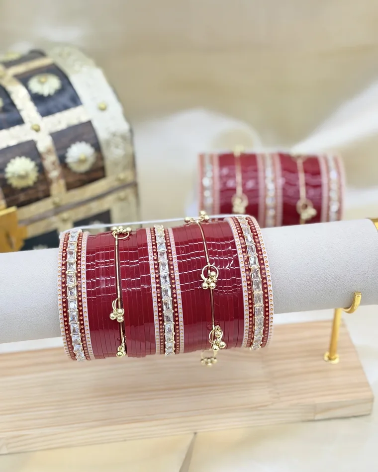 Traditional maroon bridal chooda set with CZ stone spacers and gold ghungroo charms, sizes 2.4 to 2.10 — bridal chooda Calgary