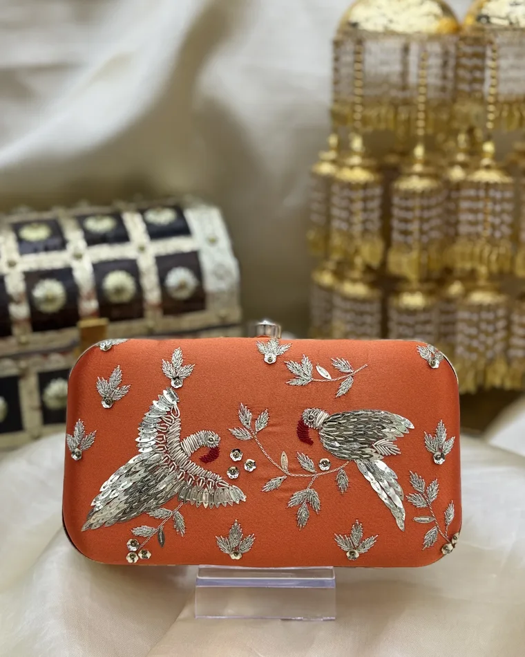Orange hand embroidered peacock clutch with gold zardozi and sequin work — Indian wedding clutch Calgary