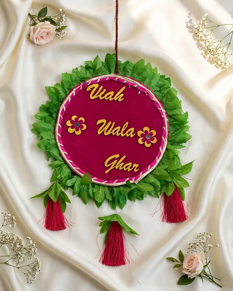 Pink velvet Viah Wala Ghar round hanging sign with green leaf trim and red tassels