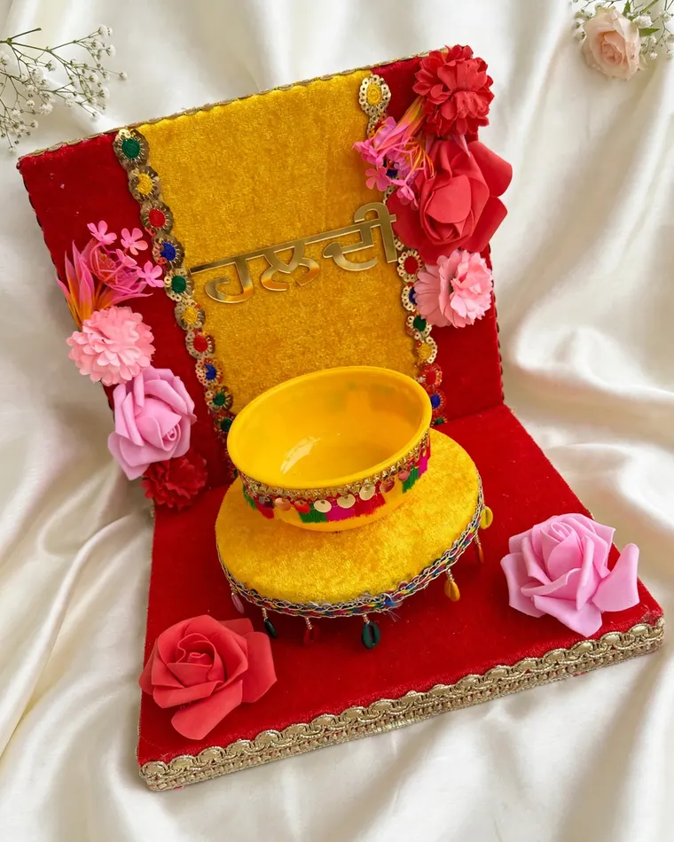 Red and yellow haldi ceremony thali set with velvet base and bowl