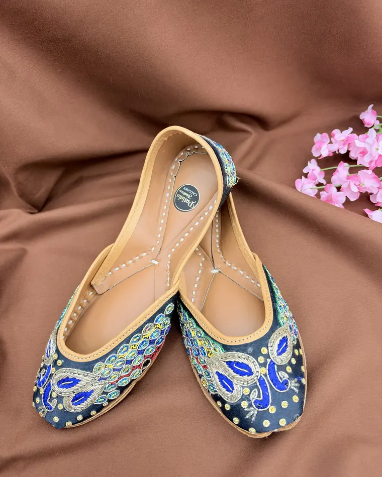 Black and gold peacock embroidered Punjabi jutti with blue threadwork — women's jutti Calgary