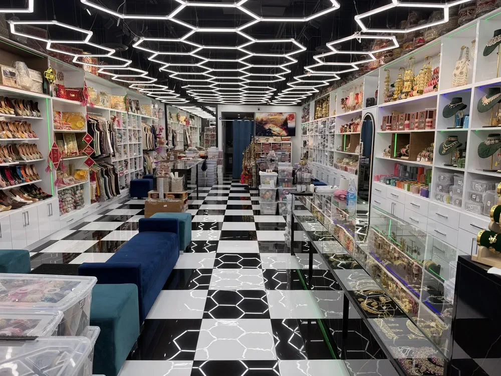 Inside Patiala Fashion Calgary — honeycomb ceiling lights, jutti shelves and bridal displays